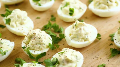 Stuffed eggs, deviled eggs on a wooden table Stock Footage 276506178