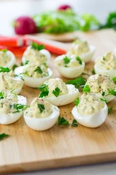 Stuffed eggs, deviled eggs on a wooden table Stock Photos