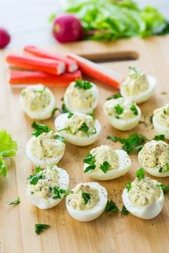 Stuffed eggs, deviled eggs on a wooden table Stock Photos