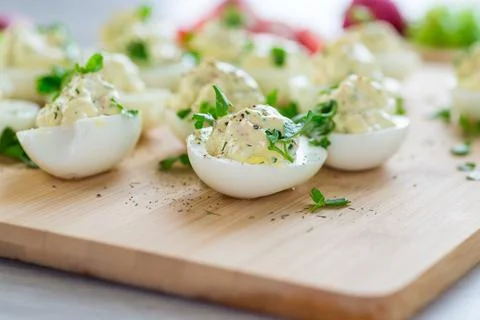 Stuffed eggs, deviled eggs on a wooden table Stock Photos
