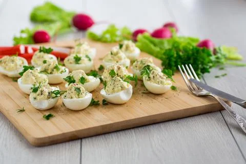 Stuffed eggs, deviled eggs on a wooden table Stock Photos
