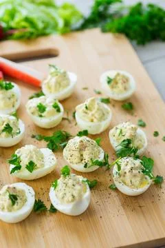 Stuffed eggs, deviled eggs on a wooden table Stock Photos