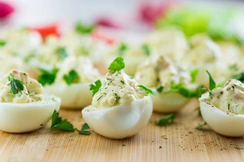 Stuffed eggs, deviled eggs on a wooden table Stock Photos