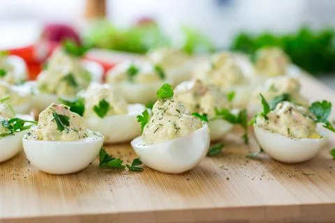 Stuffed eggs, deviled eggs on a wooden table Stock Photos