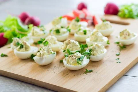 Stuffed eggs, deviled eggs on a wooden table Stock Photos