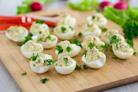 Stuffed eggs, deviled eggs on a wooden table Stock Photos