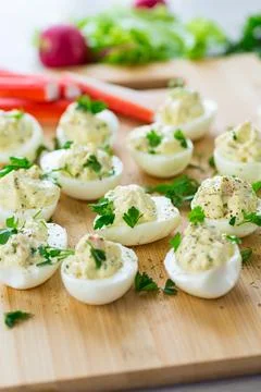 Stuffed eggs, deviled eggs on a wooden table Stock Photos