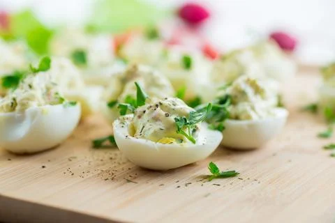 Stuffed eggs, deviled eggs on a wooden table Stock Photos