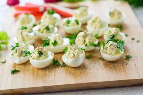Stuffed eggs, deviled eggs on a wooden table Stock Photos