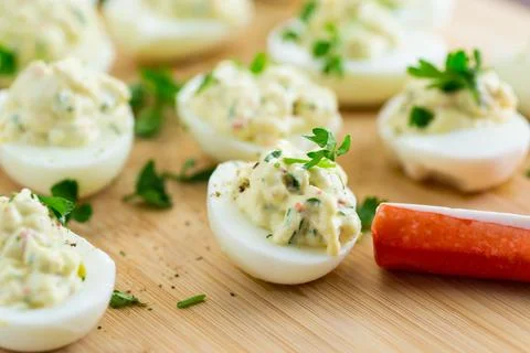 Stuffed eggs, deviled eggs on a wooden table Stock Photos