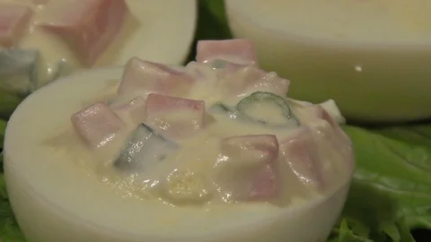 Stuffed eggs with ham, bell pepper and green onion Stock Footage 70710044