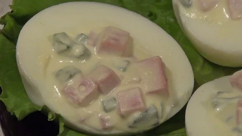 Stuffed eggs with ham, bell pepper and green onion Stock Footage 70710456