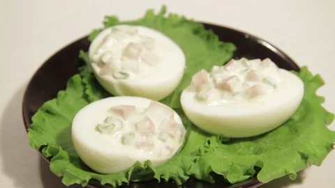 Stuffed eggs with ham, bell pepper and green onion Stock Footage 70732922