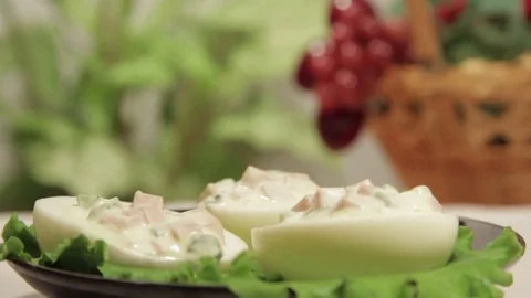 Stuffed eggs with ham, bell pepper and green onion Stock Footage 70732935