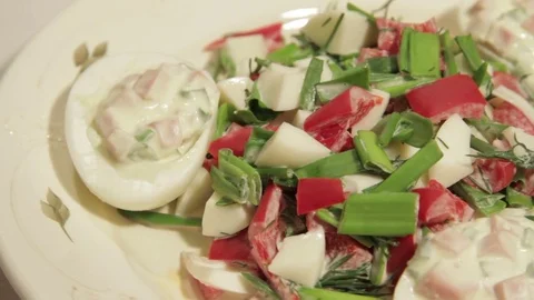 Stuffed eggs with ham, bell pepper and green onion Stock Footage 70733477