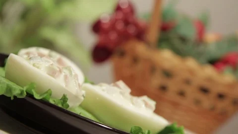 Stuffed eggs with ham, bell pepper and green onion Stock Footage 70734333