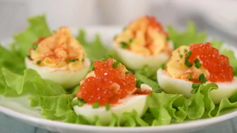 Stuffed eggs with red caviar Stock Footage 246873605