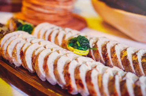 Stuffed fish, serving on a ditch with red horseradish in wooden dishes, tradi Stock Photos