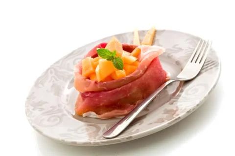 Stuffed ham with melon Stock Photos