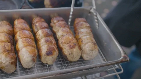 Stuffed meat roll being grilled on rack Stock Footage 87805824