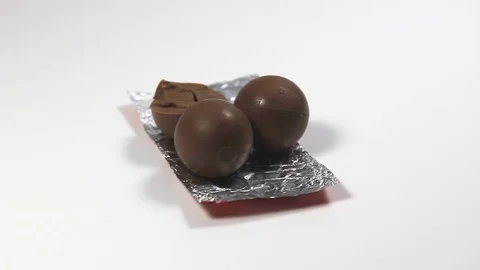 Stuffed milk chocolate balls Stock Footage 101899554