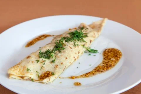 Stuffed omelet for breakfast Stock Photos