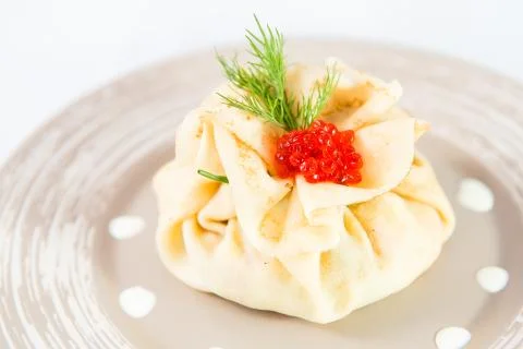 Stuffed pancake red caviar Stock Photos