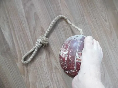 A stuffed pear with a leg on it. Stock Photos