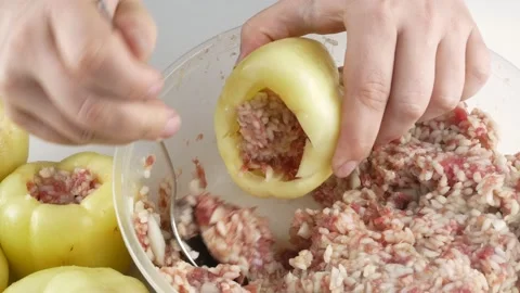 Stuffed peppers on the table.Stuffing vegetables with meat filling. 스톡 동영상 136873779