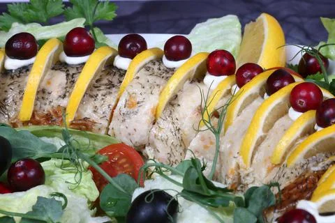 Stuffed pike decorated with slices of lemon Stock Photos