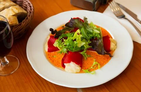 Stuffed piquillo peppers with cod brandade in sauce Stock Photos