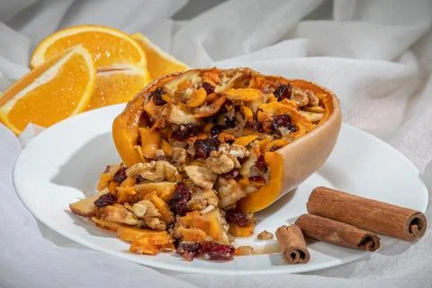 Stuffed pumpkin with nuts and dried fruits. Stock Photos