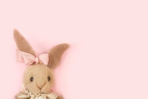 Stuffed rabbit on a pink background with copy space Stock Photos