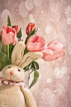 Stuffed rabbit with tulips for easter Stock Photos