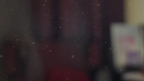 Stuffed room with dust particles flying around in close up in dirty house Stock Footage 340820940