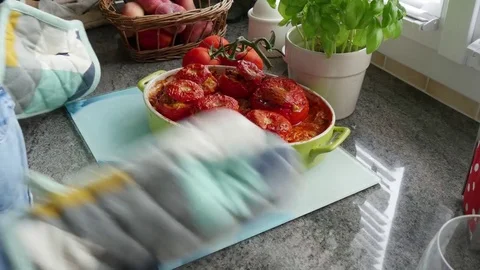 Stuffed tomato dish out of the oven Stock Footage