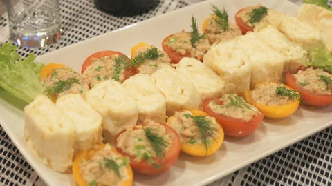 Stuffed tomatoes with cheese and cheese rolls Stock Footage 87675139