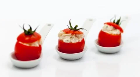 Stuffed tomatoes with cheese on white background Stock-Fotos