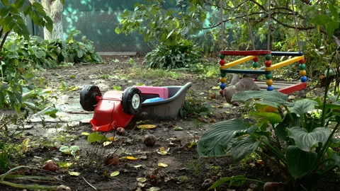 Stuffed toy swinging on swing in the backyard on an empty playground. Stock Footage 143186341