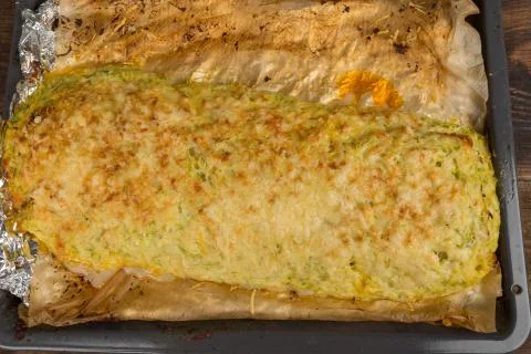 Stuffed zucchini on a baking sheet Stock Photos