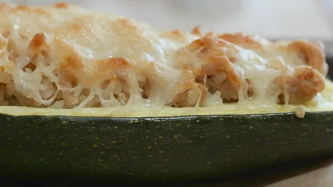 Stuffed zucchini with cheese topping,
camera pans left Video stock 312371238
