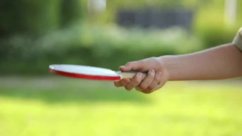 Stuffing a ball on a tennis racket Stock Footage 245178357