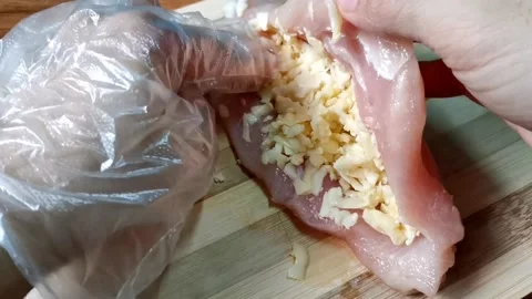 Stuffing Chicken Breast with Grated Cheese Fillings Stock Footage 148402304