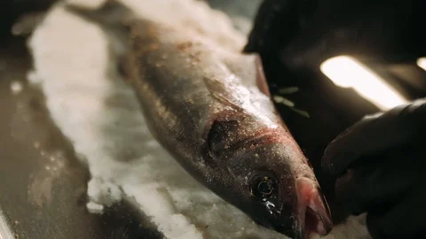 Stuffing fish with herbs Stock Footage 125458424