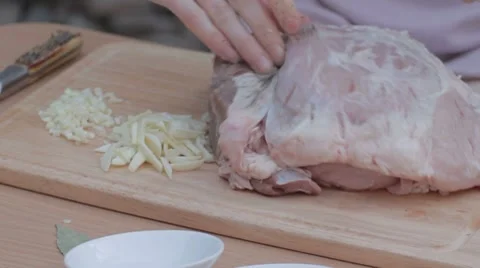 Stuffing pork with mixture of salt and pepper Stock Footage 7766786