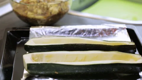 Stuffing squash boats Stock Footage 119781278