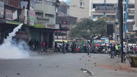 Stun grenades explode in Nairobi Riots 스톡 동영상 311483684