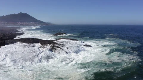 Stunning 4K drone view of powerful Atlantic waves crashing against rugged coastl Video stock 310808325