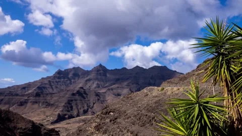 Stunning 4K Landscape View of Rugged Mountains under Cloudy Sky Stock Footage 329199502