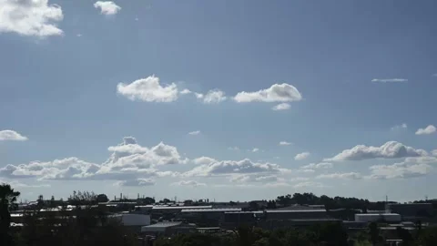 A Stunning 8k video time lapse video of clouds moving over a suburban area Stock Footage 260595207